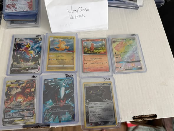 Pokemon cards for sale, including Jolteon, Charizard, and Umbreon